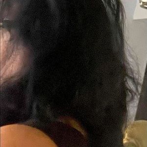 Black hair clip on extensions. Very long and wavy/curly. There are no bangs